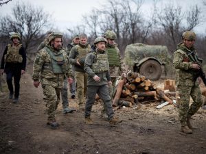 FILE PHOTO: Ukraine's President Volodymyr Zelenskiy visits positions of armed forces in Donbass region