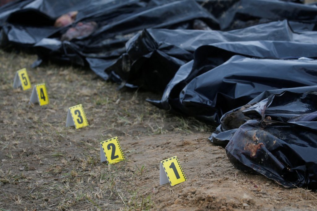 FILE PHOTO: Exhumation of bodies of civilians from a mass grave in Bucha