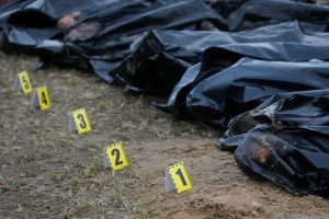 FILE PHOTO: Exhumation of bodies of civilians from a mass grave in Bucha