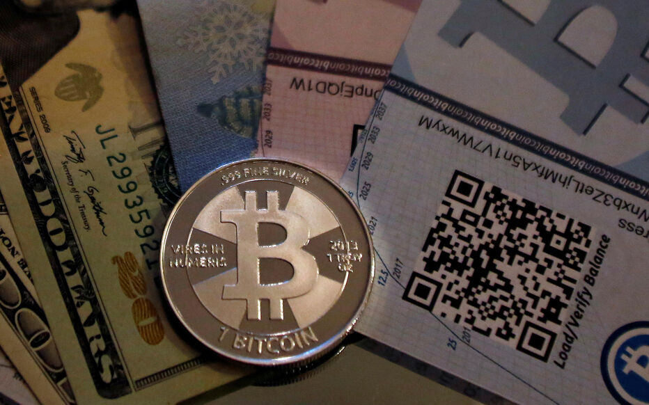 FILE PHOTO: One of Bitcoin enthusiast Mike Caldwell's coins in this photo illustration at his office in Sandy, Utah
